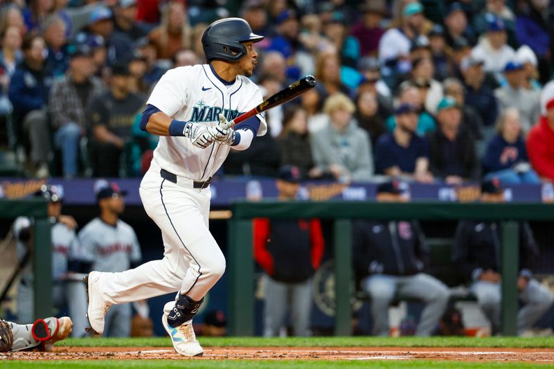 Apr 2, 2024; Seattle, Washington, USA; Seattle Mariners second baseman Jorge Polanco (7) hits a single against the Cleveland Guardians during the first inning at T-Mobile Park. Mandatory Credit: Joe Nicholson-USA TODAY Sports