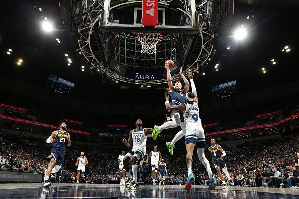 MINNEAPOLIS, MN -  NOVEMBER 1: Christian Braun #0 of the Denver Nuggets drives to the basket during the game against the Minnesota Timberwolves on November 1, 2023 at Target Center in Minneapolis, Minnesota. NOTE TO USER: User expressly acknowledges and agrees that, by downloading and or using this Photograph, user is consenting to the terms and conditions of the Getty Images License Agreement. Mandatory Copyright Notice: Copyright 2023 NBAE (Photo by David Sherman/NBAE via Getty Images)