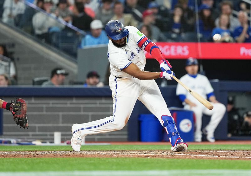 May 3, 2025; Toronto, Ontario, CAN; Toronto Blue Jays first base Vladimir Guerrero Jr. (27) hits a single against the Cleveland Guardians during the fourth inning at Rogers Centre. Mandatory Credit: Nick Turchiaro-Imagn Images