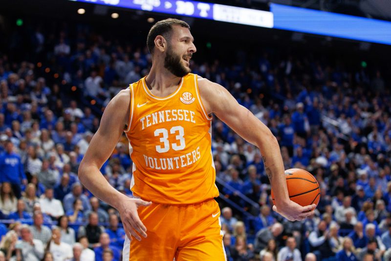 Feb 18, 2023; Lexington, Kentucky, USA; Tennessee Volunteers forward Uros Plavsic (33) hands the ball to a referee after being called for a foul during the second half against the Kentucky Wildcats at Rupp Arena at Central Bank Center. Mandatory Credit: Jordan Prather-USA TODAY Sports