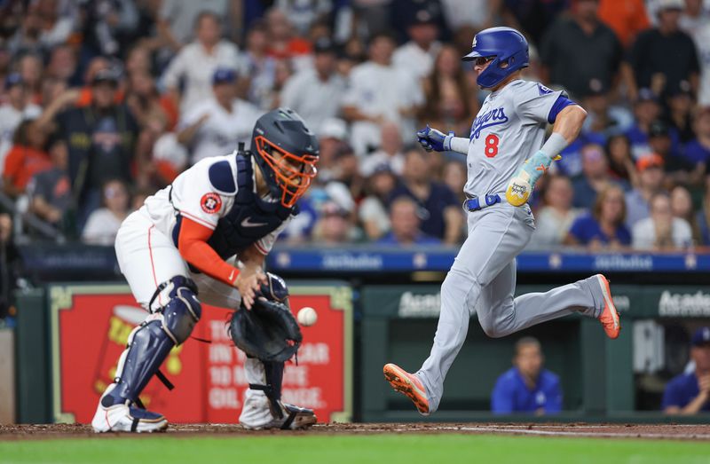 Jul 27, 2024; Houston, Texas, USA; Los Angeles Dodgers third baseman Enrique Hernandez (8) scores a run as Houston Astros catcher Yainer Diaz (21) fields a throw during the second inning at Minute Maid Park. Mandatory Credit: Troy Taormina-USA TODAY Sports
