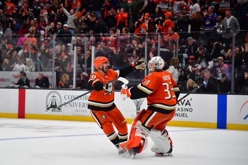 Nov 28, 2025; Anaheim, California, USA; Anaheim Ducks left wing Chris Kreider (20) and goaltender Ville Husso (33) celebrate the victory against the Los Angeles Kings following the shootout at Honda Center. Mandatory Credit: Gary A. Vasquez-Imagn Images