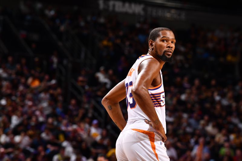 PHOENIX, AZ - OCTOBER 17: Kevin Durant #35 of the Phoenix Suns looks on during the game against the Los Angeles Lakers during a NBA Preseason game on October 17, 2024 at Footprint Center in Phoenix, Arizona. NOTE TO USER: User expressly acknowledges and agrees that, by downloading and or using this photograph, user is consenting to the terms and conditions of the Getty Images License Agreement. Mandatory Copyright Notice: Copyright 2024 NBAE (Photo by Barry Gossage/NBAE via Getty Images)