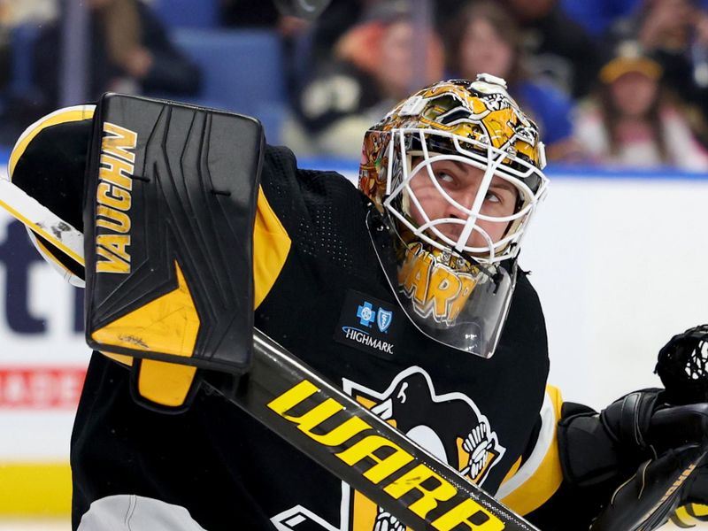 Dec 9, 2022; Buffalo, New York, USA;  Pittsburgh Penguins goaltender Tristan Jarry (35) looks for the puck after making a blocker save during the second period against the Buffalo Sabres at KeyBank Center. Mandatory Credit: Timothy T. Ludwig-USA TODAY Sports