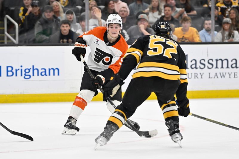 Sep 29, 2025; Boston, Massachusetts, USA;  Philadelphia Flyers center Denver Barkey (52) shoots through the defense of Boston Bruins center Sean Kuraly (52) during overtime at TD Garden. Mandatory Credit: Eric Canha-Imagn Images