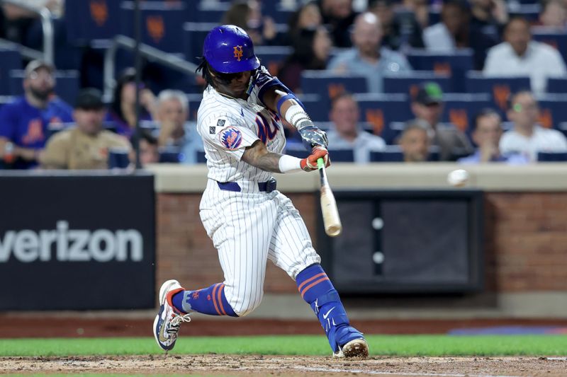 Sep 17, 2024; New York City, New York, USA; New York Mets shortstop Luisangel Acuna (2) hits an RBI double against the Washington Nationals during the third inning at Citi Field. Mandatory Credit: Brad Penner-Imagn Images