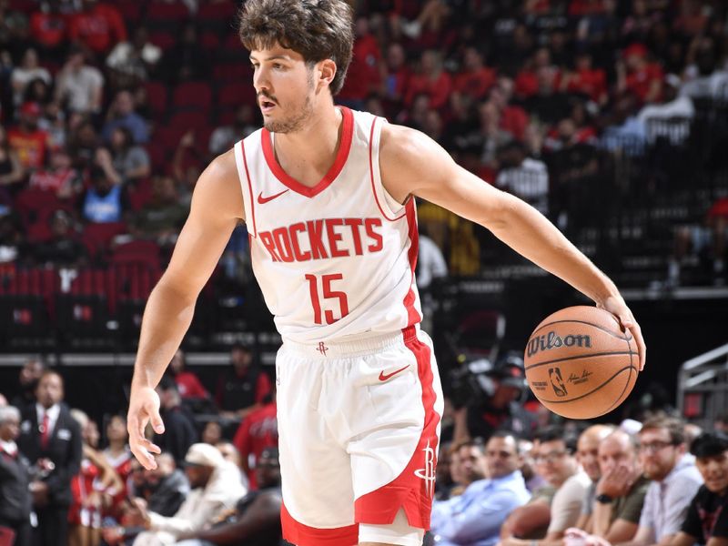 HOUSTON, TX - OCTOBER 15: Reed Sheppard #15 of the Houston Rockets dribbles the ball during the game against the New Orleans Pelicans during a NBA preseason game on October 15, 2024 at the Toyota Center in Houston, Texas. NOTE TO USER: User expressly acknowledges and agrees that, by downloading and or using this photograph, User is consenting to the terms and conditions of the Getty Images License Agreement. Mandatory Copyright Notice: Copyright 2024 NBAE (Photo by Logan Riely/NBAE via Getty Images)