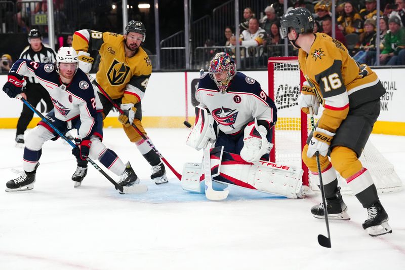 Jan 30, 2025; Las Vegas, Nevada, USA; Columbus Blue Jackets goaltender Elvis Merzlikins (90) makes a save between Vegas Golden Knights center Tomas Hertl (48) and Vegas Golden Knights left wing Pavel Dorofeyev (16) during the second period at T-Mobile Arena. Mandatory Credit: Stephen R. Sylvanie-Imagn Images