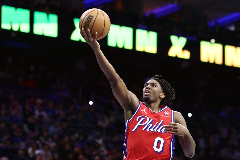 PHILADELPHIA, PENNSYLVANIA - MARCH 01: Tyrese Maxey #0 of the Philadelphia 76ers shoots a lay up during the third quarter against the Charlotte Hornets at the Wells Fargo Center on March 01, 2024 in Philadelphia, Pennsylvania. NOTE TO USER: User expressly acknowledges and agrees that, by downloading and or using this photograph, User is consenting to the terms and conditions of the Getty Images License Agreement.  (Photo by Tim Nwachukwu/Getty Images)