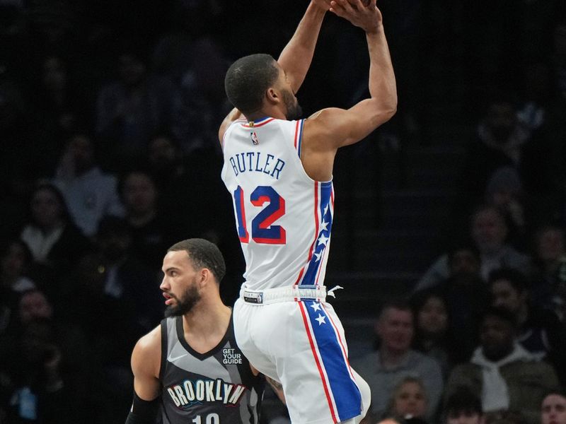 BROOKLYN, NY - FEBRUARY 12: Jared Butler #12 of the Philadelphia 76ers shoots the ball during the game against the Brooklyn Nets on February 12, 2025 at Barclays Center in Brooklyn, New York. NOTE TO USER: User expressly acknowledges and agrees that, by downloading and or using this Photograph, user is consenting to the terms and conditions of the Getty Images License Agreement. Mandatory Copyright Notice: Copyright 2025 NBAE (Photo by Jesse D. Garrabrant/NBAE via Getty Images)