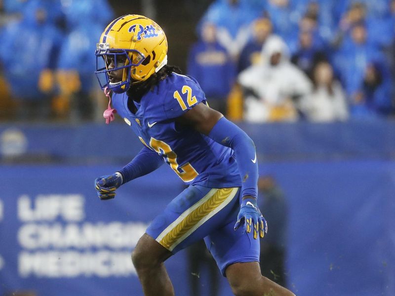 Oct 14, 2023; Pittsburgh, Pennsylvania, USA; Pittsburgh Panthers defensive back M.J. Devonshire (12) in pass coverage against the Louisville Cardinals during the second quarter at Acrisure Stadium. Mandatory Credit: Charles LeClaire-USA TODAY Sports