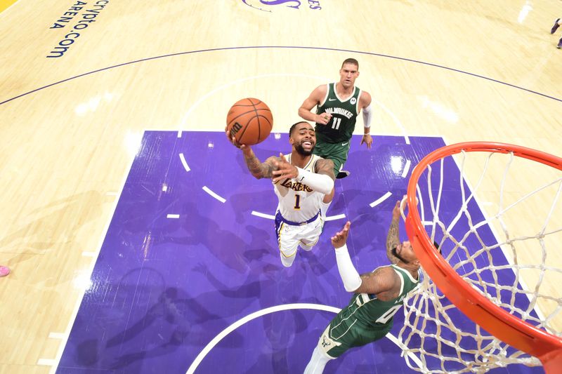 LOS ANGELES, CA - OCTOBER 15: D'Angelo Russell #1 of the Los Angeles Lakers drives to the basket during the game against the Milwaukee Bucks on October 15, 2023 at Crypto.Com Arena in Los Angeles, California. NOTE TO USER: User expressly acknowledges and agrees that, by downloading and/or using this Photograph, user is consenting to the terms and conditions of the Getty Images License Agreement. Mandatory Copyright Notice: Copyright 2023 NBAE (Photo by Adam Pantozzi/NBAE via Getty Images)