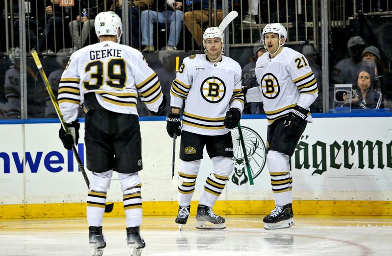 Nov 25, 2023; New York, New York, USA; Boston Bruins center Charlie Coyle (13) celebrate his second goal of the game with left wing James van Riemsdyk (21) during the third period against the New York Rangers at Madison Square Garden. Mandatory Credit: Danny Wild-USA TODAY Sports