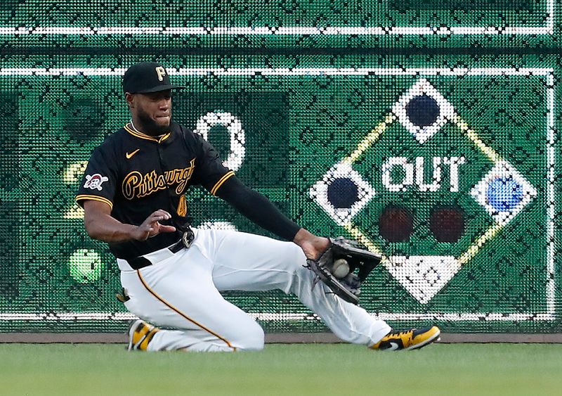 Aug 22, 2024; Pittsburgh, Pennsylvania, USA;  Pittsburgh Pirates right fielder Bryan De La Cruz (41) traps a ball hit for a single by Cincinnati Reds right fielder Amed Rosario (not pictured) during the fifth inning at PNC Park. Mandatory Credit: Charles LeClaire-USA TODAY Sports