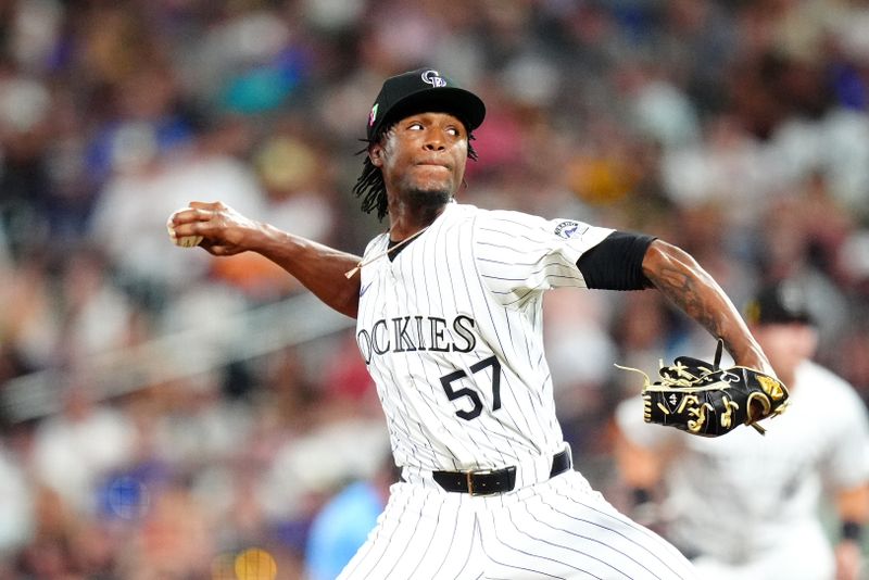 Aug 16, 2024; Denver, Colorado, USA; Colorado Rockies relief pitcher Angel Chivilli (57) delivers a pitch in the seventh inning against the San Diego Padres at Coors Field. Mandatory Credit: Ron Chenoy-USA TODAY Sports