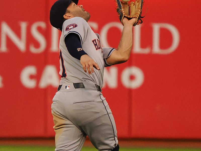 Jul 22, 2024; Oakland, California, USA; Houston Astros second baseman Jose Altuve (27) catches the ball against the Oakland Athletics during the fifth inning at Oakland-Alameda County Coliseum. Mandatory Credit: Kelley L Cox-USA TODAY Sports