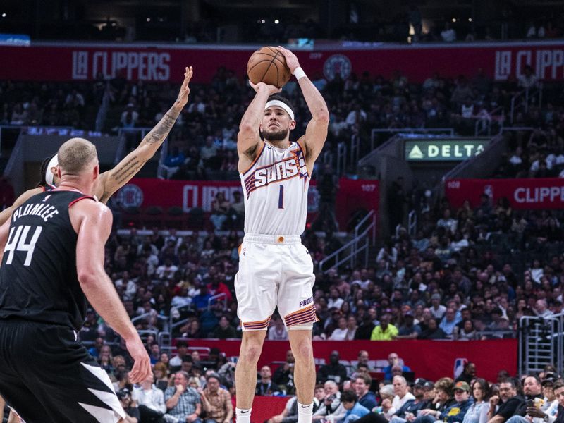 LOS ANGELES, CA - APRIL 10: Devin Booker #1 of the Phoenix Suns shoots the ball during the game against the LA Clippers on April 10, 2024 at Crypto.Com Arena in Los Angeles, California. NOTE TO USER: User expressly acknowledges and agrees that, by downloading and/or using this Photograph, user is consenting to the terms and conditions of the Getty Images License Agreement. Mandatory Copyright Notice: Copyright 2024 NBAE (Photo by Tyler Ross/NBAE via Getty Images)