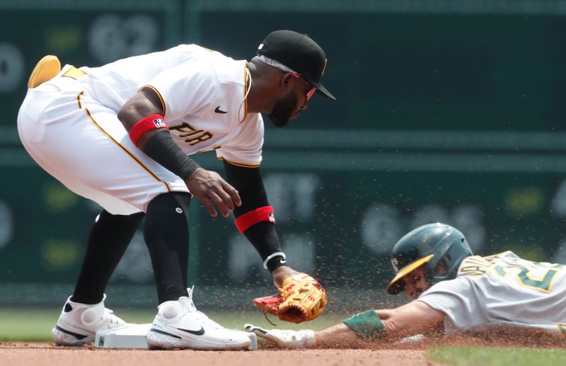 Jun 7, 2023; Pittsburgh, Pennsylvania, USA;  Oakland Athletics right fielder Ramon Laureano (22) attempts to steal second base against Pittsburgh Pirates shortstop Rodolfo Castro (14) during the fourth inning  at PNC Park. Mandatory Credit: Charles LeClaire-USA TODAY Sports