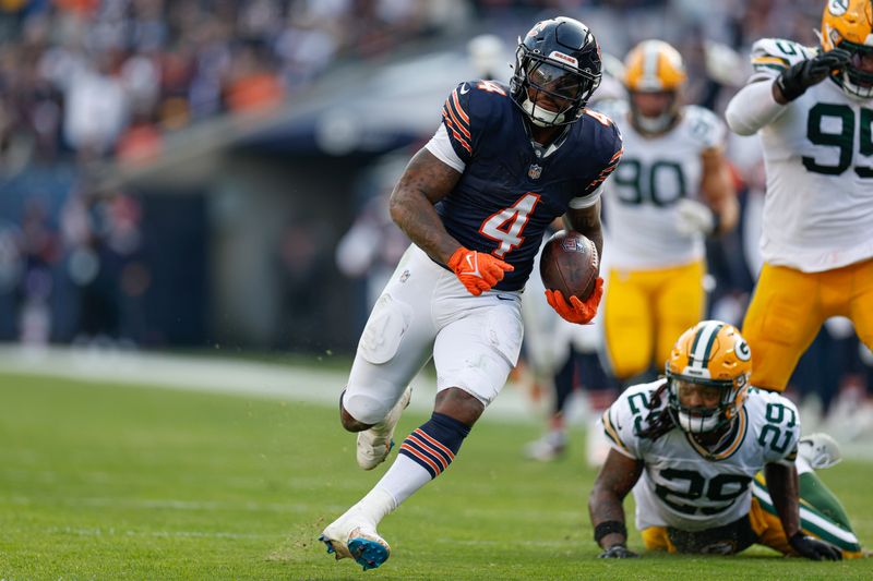 Chicago Bears running back D'Andre Swift (4) runs to score a touchdown against the Green Bay Packers during the second half of an NFL football game, Sunday, Nov. 17, 2024, in Chicago. (AP Photo/Kamil Krzaczynski)