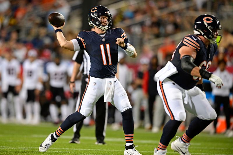 Chicago Bears quarterback Brett Rypien (11) throws a touchdown pass during the second half of an NFL exhibition Hall of Fame football game against the Houston Texans, Thursday, Aug. 1, 2024, in Canton, Ohio. (AP Photo/David Dermer)