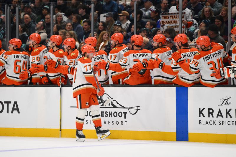 Nov 27, 2024; Seattle, Washington, USA; Anaheim Ducks right wing Frank Vatrano (77) celebrates with the bench after scoring a goal against the Seattle Kraken during the first period at Climate Pledge Arena. Mandatory Credit: Steven Bisig-Imagn Images