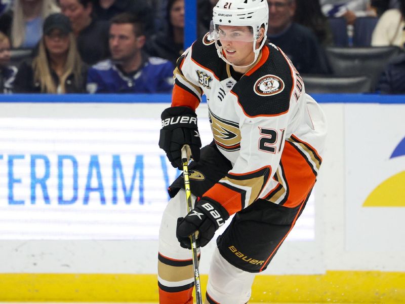 Jan 13, 2024; Tampa, Florida, USA;  Anaheim Ducks center Isac Lundestrom (21) controls the puck against the Tampa Bay Lightning in the third period at Amalie Arena. Mandatory Credit: Nathan Ray Seebeck-USA TODAY Sports