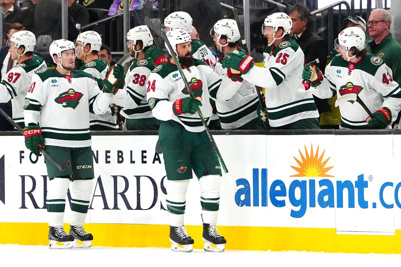 Mar 6, 2026; Las Vegas, Nevada, USA; Minnesota Wild defenseman Zach Bogosian (24) celebrates with team mates after scoring a goal against the Vegas Golden Knights during the second period at T-Mobile Arena. Mandatory Credit: Stephen R. Sylvanie-Imagn Images
