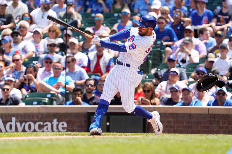 May 31, 2023; Chicago, Illinois, USA; Chicago Cubs center fielder Mike Tauchman (40) hits a one-run single against the Tampa Bay Rays during the first inningat Wrigley Field. Mandatory Credit: David Banks-USA TODAY Sports