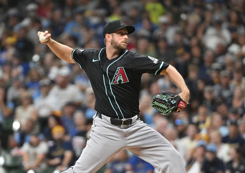 Sep 21, 2024; Milwaukee, Wisconsin, USA; Arizona Diamondbacks pitcher Merrill Kelly (29) delivers a pitch against the Milwaukee Brewers in the first inning at American Family Field. Mandatory Credit: Michael McLoone-Imagn Images