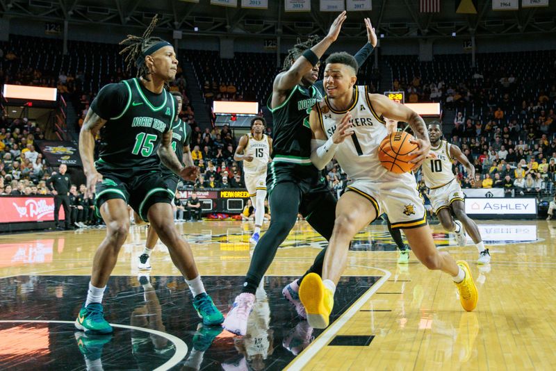 Jan 4, 2024; Wichita, Kansas, USA; Wichita State Shockers guard Xavier Bell (1) drives to the basket during the first half against the North Texas Mean Green at Charles Koch Arena. Mandatory Credit: William Purnell-USA TODAY Sports