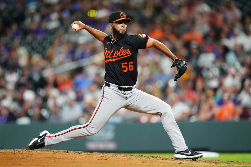 Aug 30, 2024; Denver, Colorado, USA; Baltimore Orioles relief pitcher Seranthony Dominguez (56) delivers a pitch in the ninth inning against the Colorado Rockies at Coors Field. Mandatory Credit: Ron Chenoy-USA TODAY Sports