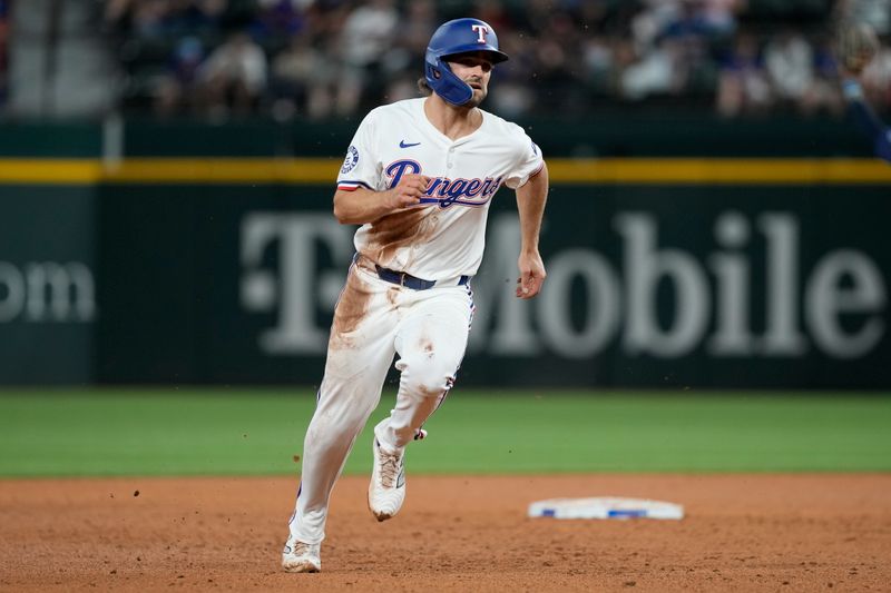 Apr 24, 2024; Arlington, Texas, USA; Texas Rangers third baseman Josh Smith (8) runs to third on a single hit by designated hitter Wyatt Langford (not shown) against the Seattle Mariners during the sixth inning at Globe Life Field. Mandatory Credit: Jim Cowsert-USA TODAY Sports