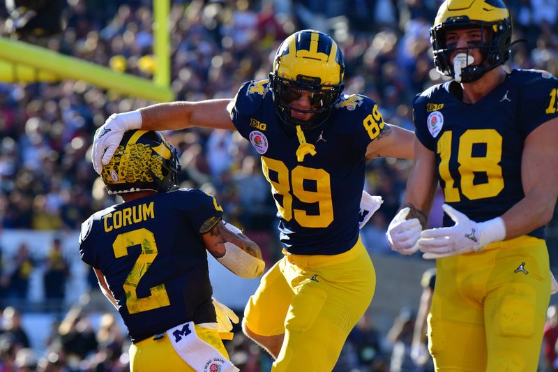 Jan 1, 2024; Pasadena, CA, USA; Michigan Wolverines running back Blake Corum (2) celebrates with Michigan Wolverines tight end AJ Barner (89) after scoring a touchdown against the Alabama Crimson Tide in the first quarter in the 2024 Rose Bowl college football playoff semifinal game at Rose Bowl. Mandatory Credit: Gary A. Vasquez-USA TODAY Sports