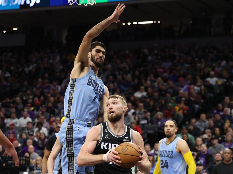 SACRAMENTO, CALIFORNIA - JANUARY 23:  Domantas Sabonis #10 of the Sacramento Kings goes up for a shot on Santi Aldama #7 of the Memphis Grizzlies in the second half at Golden 1 Center on January 23, 2023 in Sacramento, California. NOTE TO USER: User expressly acknowledges and agrees that, by downloading and or using this photograph, User is consenting to the terms and conditions of the Getty Images License Agreement.  (Photo by Ezra Shaw/Getty Images)