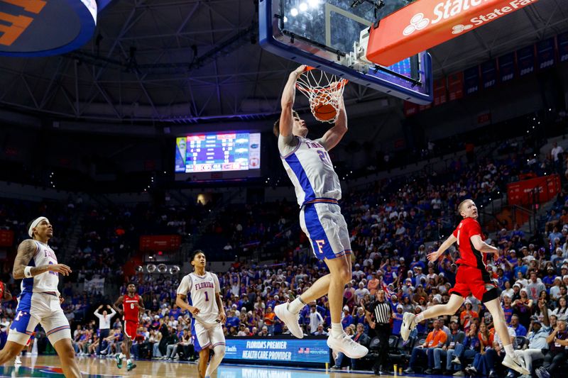 Jan 6, 2026; Gainesville, Florida, USA; Florida Gators forward Alex Condon (21) dunks against the Georgia Bulldogs during the second half at Exactech Arena at the Stephen C. O'Connell Center. Mandatory Credit: Morgan Tencza-Imagn Images