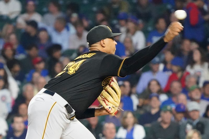 Sep 21, 2023; Chicago, Illinois, USA; Pittsburgh Pirates starting pitcher Johan Oviedo (24) throws the ball against the Chicago Cubs during the first inning at Wrigley Field. Mandatory Credit: David Banks-USA TODAY Sports