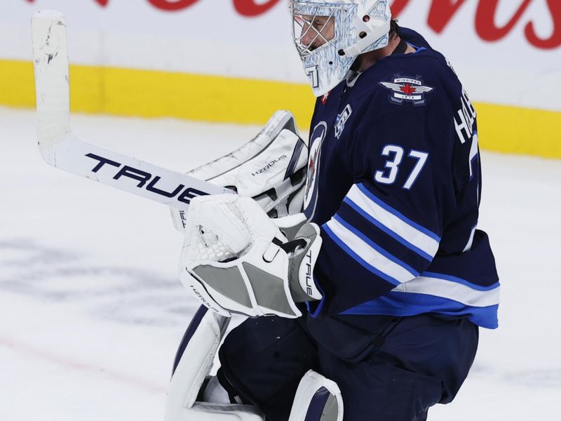 Oct 11, 2025; Winnipeg, Manitoba, CAN; Winnipeg Jets goaltender Connor Hellebuyck (37) celebrates the Winnipeg Jets victory against the Los Angeles Kings at Canada Life Centre. Mandatory Credit: James Carey Lauder-Imagn Images