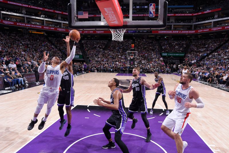 SACRAMENTO, CA - APRIL 2:  Russell Westbrook #0 of the LA Clippers goes to the basket during the game on April 2, 2024 at Golden 1 Center in Sacramento, California. NOTE TO USER: User expressly acknowledges and agrees that, by downloading and or using this Photograph, user is consenting to the terms and conditions of the Getty Images License Agreement. Mandatory Copyright Notice: Copyright 2024 NBAE (Photo by Rocky Widner/NBAE via Getty Images)