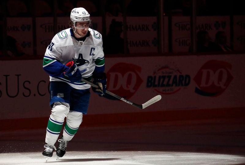 Jan 11, 2024; Pittsburgh, Pennsylvania, USA; Vancouver Canucks defenseman Quinn Hughes (43) takes the ice against the Pittsburgh Penguins during the first period at PPG Paints Arena. Mandatory Credit: Charles LeClaire-USA TODAY Sports