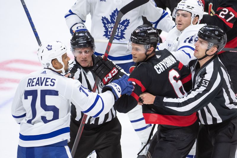 Feb 10, 2024; Ottawa, Ontario, CAN; Toronto Maple Leafs right wing Ryan Reaves (75) has an exchange with Ottawa Senators defenseman Jakob Chichrun (6) at the end of the third period at the Canadian Tire Centre. Mandatory Credit: Marc DesRosiers-USA TODAY Sports