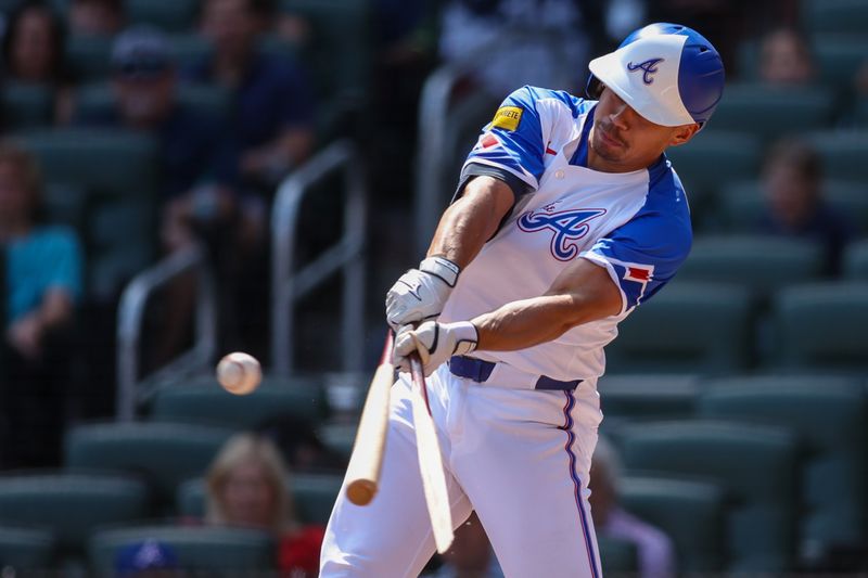 May 24, 2025; Atlanta, Georgia, USA; Atlanta Braves catcher Drake Baldwin (30) breaks his bat on a single against the San Diego Padres in the first inning at Truist Park. Mandatory Credit: Brett Davis-Imagn Images