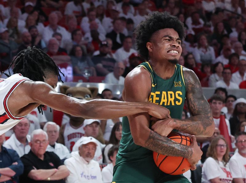 Feb 10, 2025; Houston, Texas, USA; Houston Cougars guard Mylik Wilson (8) tries to steal the ball from Baylor Bears guard Jayden Nunn (2) in the first half at Fertitta Center. Mandatory Credit: Thomas Shea-Imagn Images