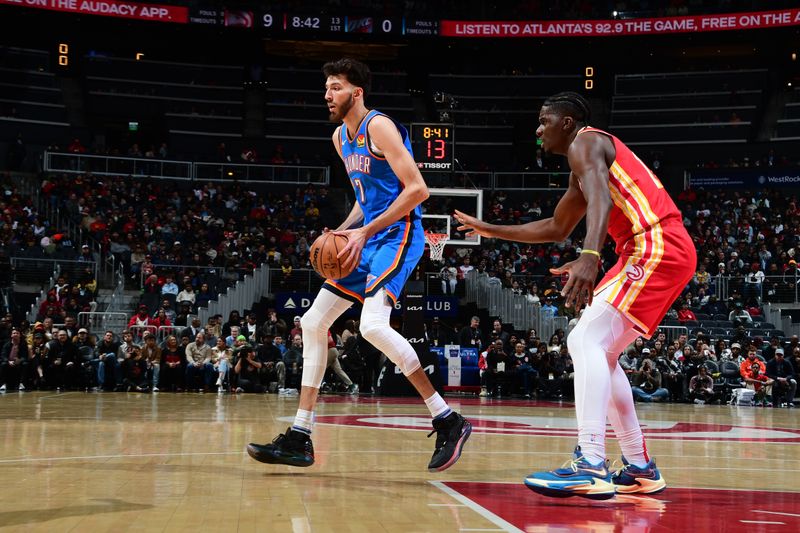 ATLANTA, GA - JANUARY 3: Chet Holmgren #7 of the Oklahoma City Thunder handles the ball during the game against the Atlanta Hawks on January 3, 2024 at State Farm Arena in Atlanta, Georgia.  NOTE TO USER: User expressly acknowledges and agrees that, by downloading and/or using this Photograph, user is consenting to the terms and conditions of the Getty Images License Agreement. Mandatory Copyright Notice: Copyright 2024 NBAE (Photo by Scott Cunningham/NBAE via Getty Images)