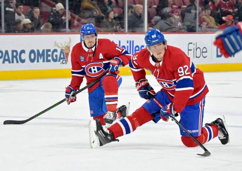 Mar 3, 2025; Montreal, Quebec, CAN; Montreal Canadiens forward Brendan Gallagher (11) and teammate Montreal Canadiens forward Patrik Laine (92) stretch during the warmup period before the game against the Buffalo Sabres at the Bell Centre. Mandatory Credit: Eric Bolte-Imagn Images