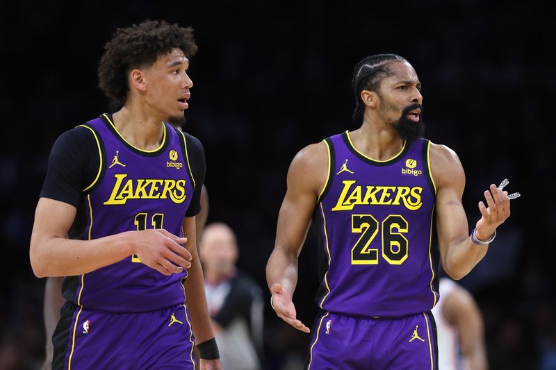 LOS ANGELES, CALIFORNIA - MARCH 22: Spencer Dinwiddie #26 questions a foul call as Jaxson Hayes #11 of the Los Angeles Lakers looks on during the first half of a game against the Philadelphia 76ers at Crypto.com Arena on March 22, 2024 in Los Angeles, California. NOTE TO USER: User expressly acknowledges and agrees that, by downloading and/or using this photograph, user is consenting to the terms and conditions of the Getty Images License Agreement. (Photo by Sean M. Haffey/Getty Images)