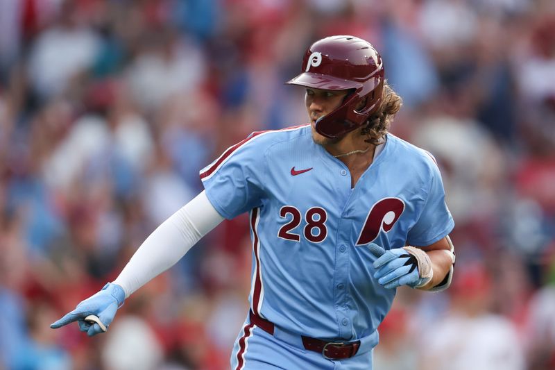 Aug 15, 2024; Philadelphia, Pennsylvania, USA; Philadelphia Phillies third base Alec Bohm (28) reacts after hitting a three RBI home run during the first inning against the Washington Nationals at Citizens Bank Park. Mandatory Credit: Bill Streicher-USA TODAY Sports