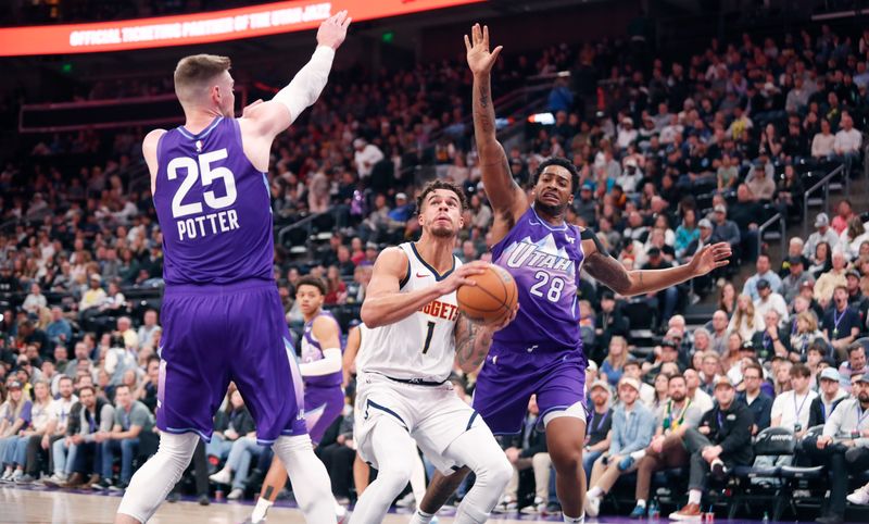 SALT LAKE CITY , UT - NOVEMBER 27:  Micah Potter #25 and Brice Sensabaugh #28 of the Utah Jazz pressure Michael Porter Jr., #1 of the Denver Nuggets during the second half of their game at the Delta Center on November 27, 2024 in Salt Lake City, Utah.  NOTE TO USER: User expressly acknowledges and agrees that, by downloading and or using this photograph, User is consenting to the terms and conditions of the Getty Images License Agreement. (Photo by Chris Gardner/Getty Images)