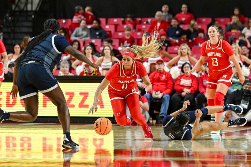 Feb 18, 2024; College Park, Maryland, USA;  Maryland Terrapins guard Jakia Brown-Turner (11) runs down  loose ball infant of Penn State Nittany Lions guard Leilani Kapinus (5) during the second  half at Xfinity Center. Mandatory Credit: Tommy Gilligan-USA TODAY Sports