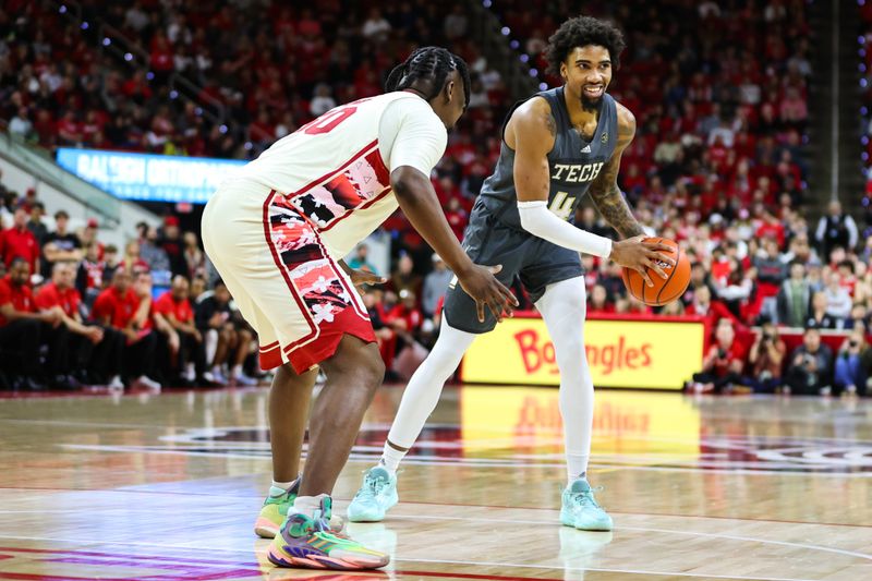 Feb 4, 2023; Raleigh, North Carolina, USA; Georgia Tech Yellow Jackets forward Javon Franklin (4) dribbles the ball defended by North Carolina State Wolfpack forward D.J. Burns Jr. (30) during the second half of the game at PNC Arena. Mandatory Credit: Jaylynn Nash-USA TODAY Sports