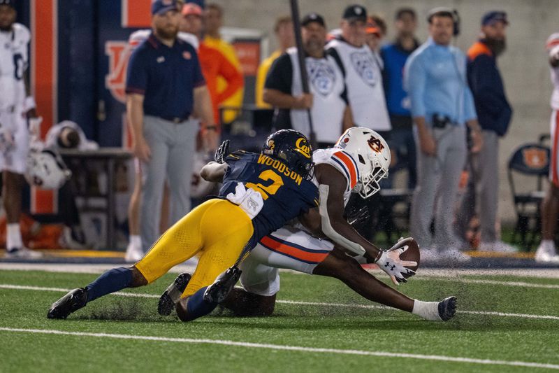 Sep 9, 2023; Berkeley, California, USA; Auburn Tigers tight end Rivaldo Fairweather (13) makes a catch for a first down against California Golden Bears defensive back Craig Woodson (2) during the fourth quarter  at California Memorial Stadium. Mandatory Credit: Neville E. Guard-USA TODAY Sports